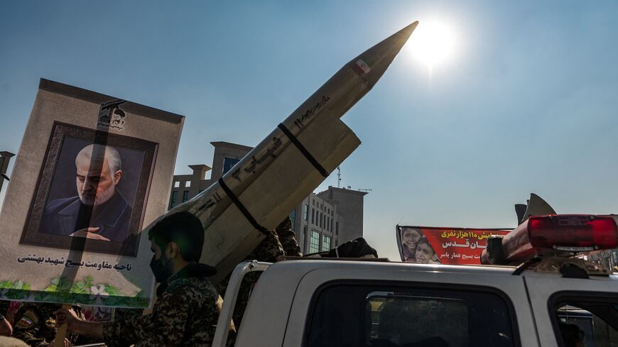 A pick-up truck that carries a moc-kup of a Shahab-3 missile and its launcher during a parade of an alleged 110,000 paramilitary Basij and Islamic Revolutionary Guard Corp forces in downtown Tehran, Iran, on Jan. 10, 2025. 