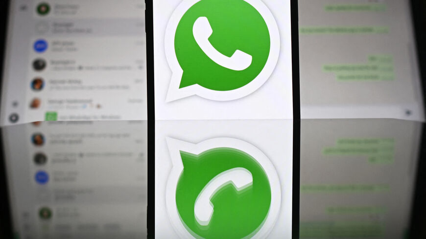 An illustration photograph taken on April 17, 2025 shows Whatsapp web displayed on a laptop screen with a phone displaying the Whatsapp logo, in a residential property in Guildford, south of London. (Photo by Justin TALLIS / AFP) (Photo by JUSTIN TALLIS/AFP via Getty Images)