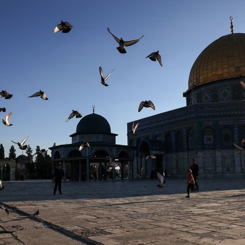 Pigeons fly in front of the Dome of the Rock shrine at the Al-Aqsa mosques compound in the Old City of Jerusalem, ahead of the start of the Muslim holy fasting month of Ramadan on Feb. 28, 2025. 